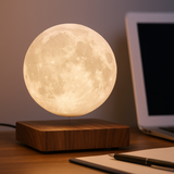 Close view of the AerLune moon lamp floating on a work desk