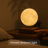 Hand using the AerLune base touch control in a dim bedroom