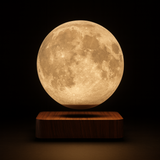 AerLune moon lamp glowing warm amber against a dark background