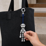 Mr. Bones pull-cord skeleton hanging from a car mirror