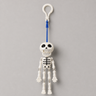 Mr. Bones pull-cord dancing skeleton keychain on a clean white background